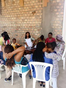 Strong community response: Clients line up for blood pressure checks and family planning services, with distribution of Moringa powder to support household nutrition.