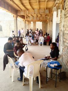 Laboratory care up close A laboratory technician carefully draws a blood sample from a client for diabetes screening.